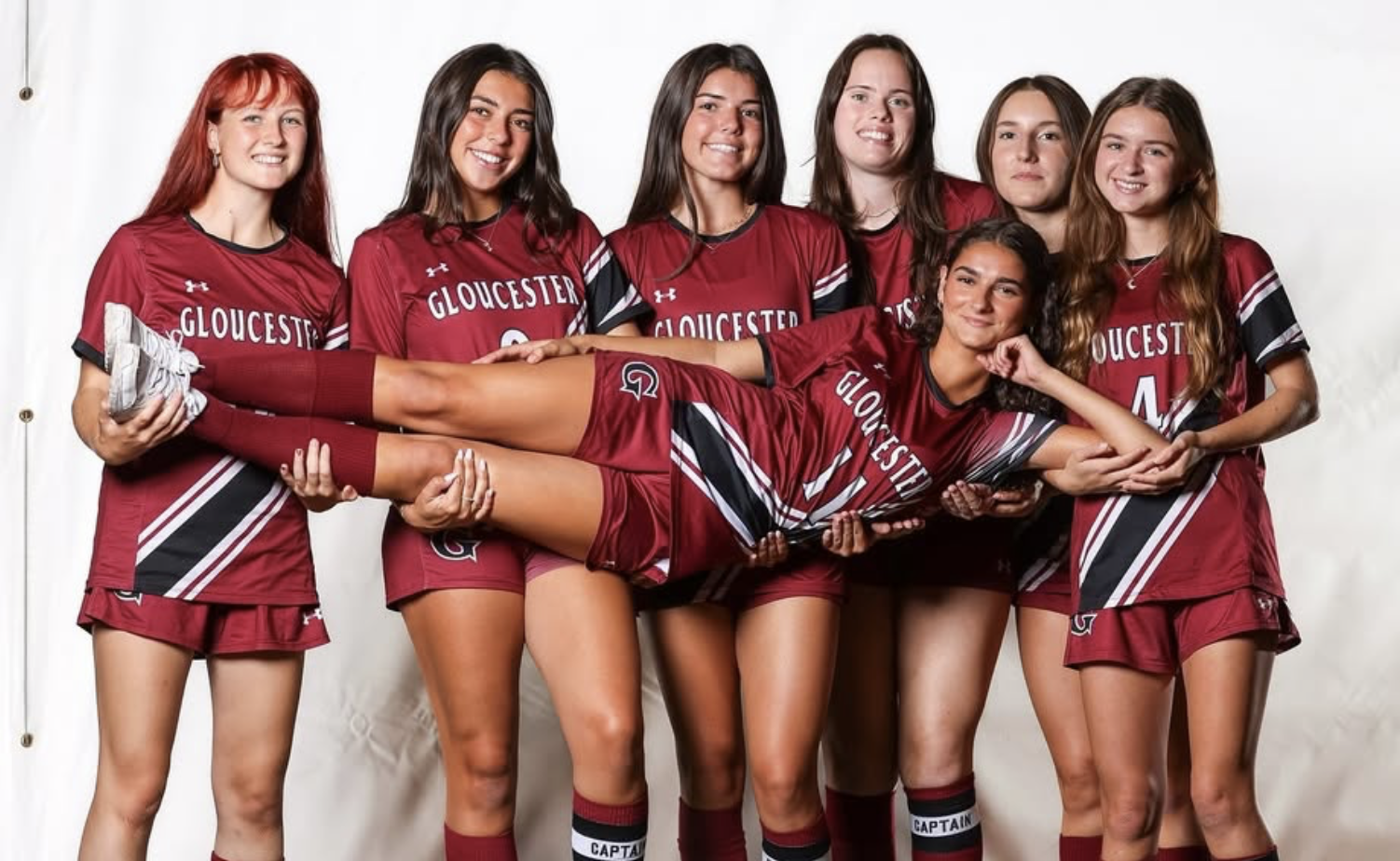 GHS girls soccer seniors pose during their senior photoshoot together.